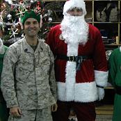 John Sakowicz celebrates Christmas in Iraq 2006. Santa is Sgt Brian Dinning. Green elves are Corporals Winter and Green. Photo courtesy of John Sakowicz.